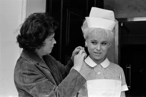 Barbara Windsor (right) having her hair sorted on the film set of Carry On Doctor