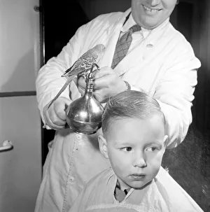 Barber Shop Humour: Mr. Jim Reid with Billy the Budgie seen here at the barber shop