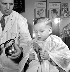 Barber Shop Humour: Mr. Jim Reid with Billy the Budgie seen here at the barber shop