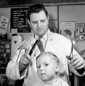 Barber Shop Humour: Mr. Jim Reid with Billy the Budgie seen here at the barber shop