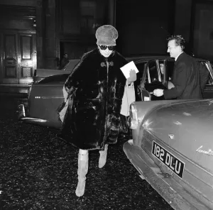 Barbra Streisand, exits car to make her way to stage door entrance at Prince of Wales
