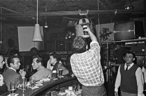 Cigarettes Prints: Barman at the Old Eden Saloon, Berlin loads a pint of beer into the sputnik for transport