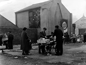 Fruit Prints: Barrow boys carry on trading at the Broughton Street site on 7th July 1958