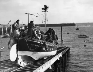 The Barry Dock lifeboat slides down the slipway as she leaves dock to deliver Christmas