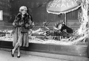 Barry Humphries as Dame Edna Everage outside the shop window at Selfridges
