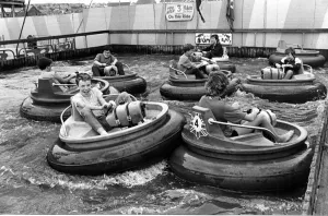 Fairground Prints: Barry Island - Children enjoy their time on the bumper boats at the funfair at Barry
