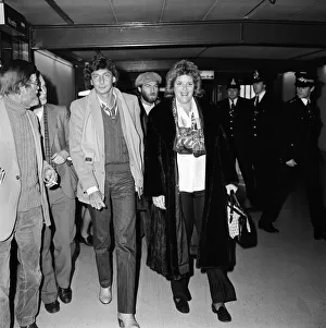 Jeans Prints: Barry Manilow arriving at Heathrow Airport with Roberta Kent. 7th January 1982