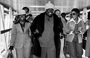 Barry White American soul singer arriving at Heathrow Airport with his wife Glodean White