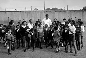 Basil D Oliveira Cricket Player in South Africa with a group of children