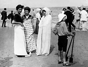 Spade Prints: Bathers at Norderney France modelling fashion on a beach in 1911 Wearing beach