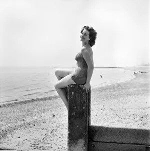 Bathing Girl: Glamour on the Clacton Beach: Who will go rowing with Christine Reynolds