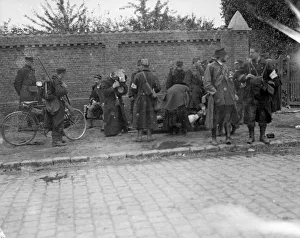 First Aid Prints: Battle of Hofstade. Priests attended to an injured soldier as a cycle patrol set out