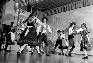 00067 Prints: Bavarian couples in traditional dress dancing on stage during a night out in Ruhpolding