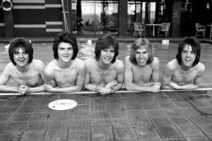 The Bay City Rollers celebrate their chart success with a quick dip in the pool
