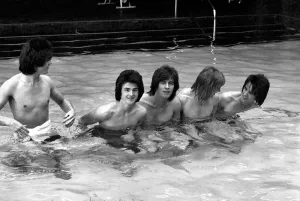 The Bay City Rollers celebrate their chart success with a quick dip in the pool