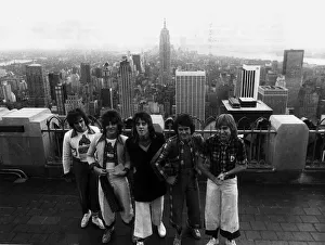 Bay City Rollers standing on top of the RCA building in New York during their first tour