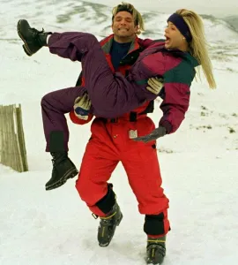 Baywatch stars Gena Lee Nolin being carried by actor David Chokachi while visiting