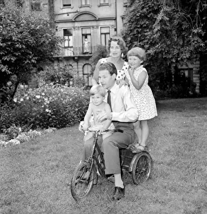 BBC Announcer Alexander McIntosh seen here at home with his wife and children. Circa 1957