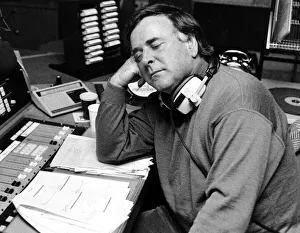 BBC radio disc jockey Terry Wogan asleep at his desk as he returns to BBC Radio Two after