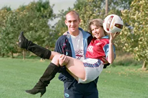 BBC Radio WM presenter Julie Mayer in an Aston Villa kit with Villa midfielder Mark
