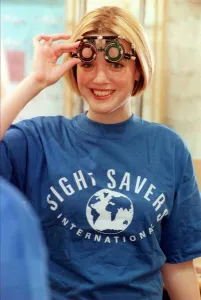 00157 Prints: BBC TV Presenter Kate Heavner October 1999 About to test her eye sight at Boots