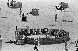Beach scenes in Ramsgate. Holidaymakers in a village circle