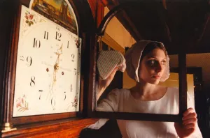Beamish Museum staff member Sara Williamson in the dress of a 1820s kitchen maid with a