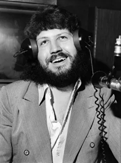 Headphones Prints: Bearded Dave Lee Travis, BBC Disc Jockey in the studio today. September 1972 P005991
