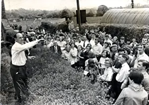 Beating the bounds - Llantrisant - Freshly minted coins are flung into the crowd by Eddie