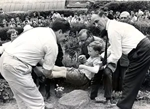 00363 Prints: Beating the bounds - Llantrisant - Townspeople watch as seven-year-old Kevin Davies is