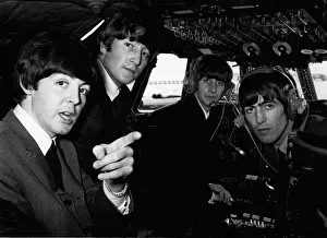 Planes Prints: Beatles 1960s pop band in the cockpit of an aircraft before flying to Liverpool