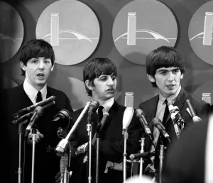 00084 Prints: The Beatles answer questions for newsmen and journalists in New York after their arrival