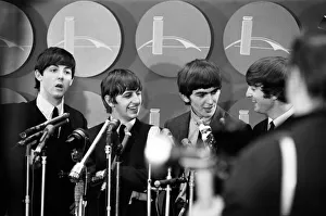 00587 Prints: The Beatles answer questions for newsmen and journalists in New York after their arrival