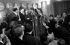Core08 Prints: The Beatles answer questions for newsmen and journalists at a press conference upon their