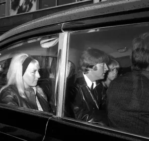 Two of The Beatles arrive at back at London Airport, from their holidays George Harrison