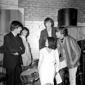 The Beatles backstage at the Futurist theatre in Scarborough with Cherry Rowland one of