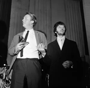 Beatles drummer Ringo Starr presents a Grammy Award to 22 year old EMI recording engineer