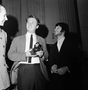 Beatles drummer Ringo Starr presents a Grammy Award to 22-year-old EMI recording engineer