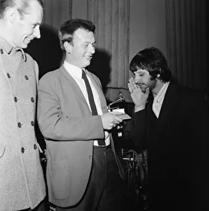 01362 Prints: Beatles drummer Ringo Starr presents a Grammy Award to 22-year-old EMI recording engineer
