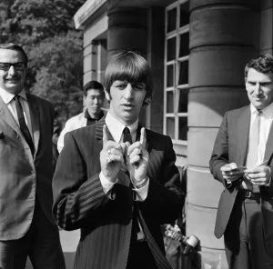 Gesture Prints: Beatles drummer Ringo Starr speaks to the press after the birth of his baby boy Zak