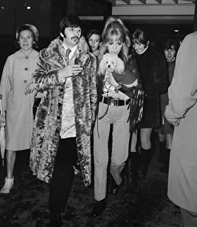 Beatles drummer Ringo Starr and wife Maureen (with pet poodle) arrive in Liverpool