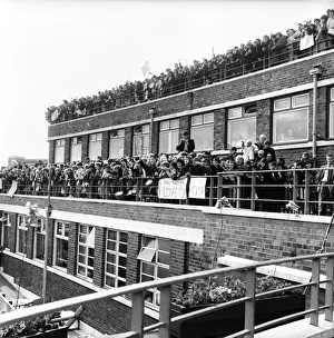 Beatlemania Prints: Beatles fans packed onto a building terrace and rooftop as they try to get a glimpse of