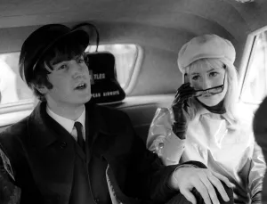 00180 Prints: The Beatles February 1964 John Lennon and his wife Cynthia in the back of a car