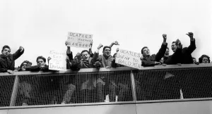 The Beatles February 1964 Protestors and enthusiastic banners greet the Beatles