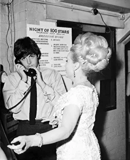 Beatles Files 1964 Paul McCartney on the phone standing beside Zsa Zsa Gabor during