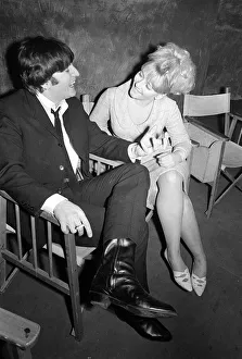 The Beatles on film set for a Hard Days Night John lennon talking to a girl on set