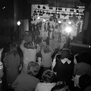 The Beatles filming at the Scala Theatre watched by a crowd of screaming fans 31st