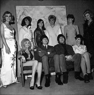 Beatles John Lennon and Paul McCartney backstage with show girls during the Music of