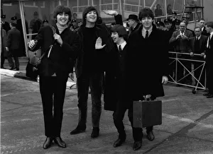 The Beatles leave London Airport bound for the Bahamas to commence filming on their