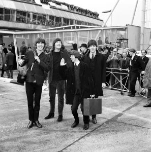 The Beatles leave London Airport bound for the Bahamas to commence filming on their